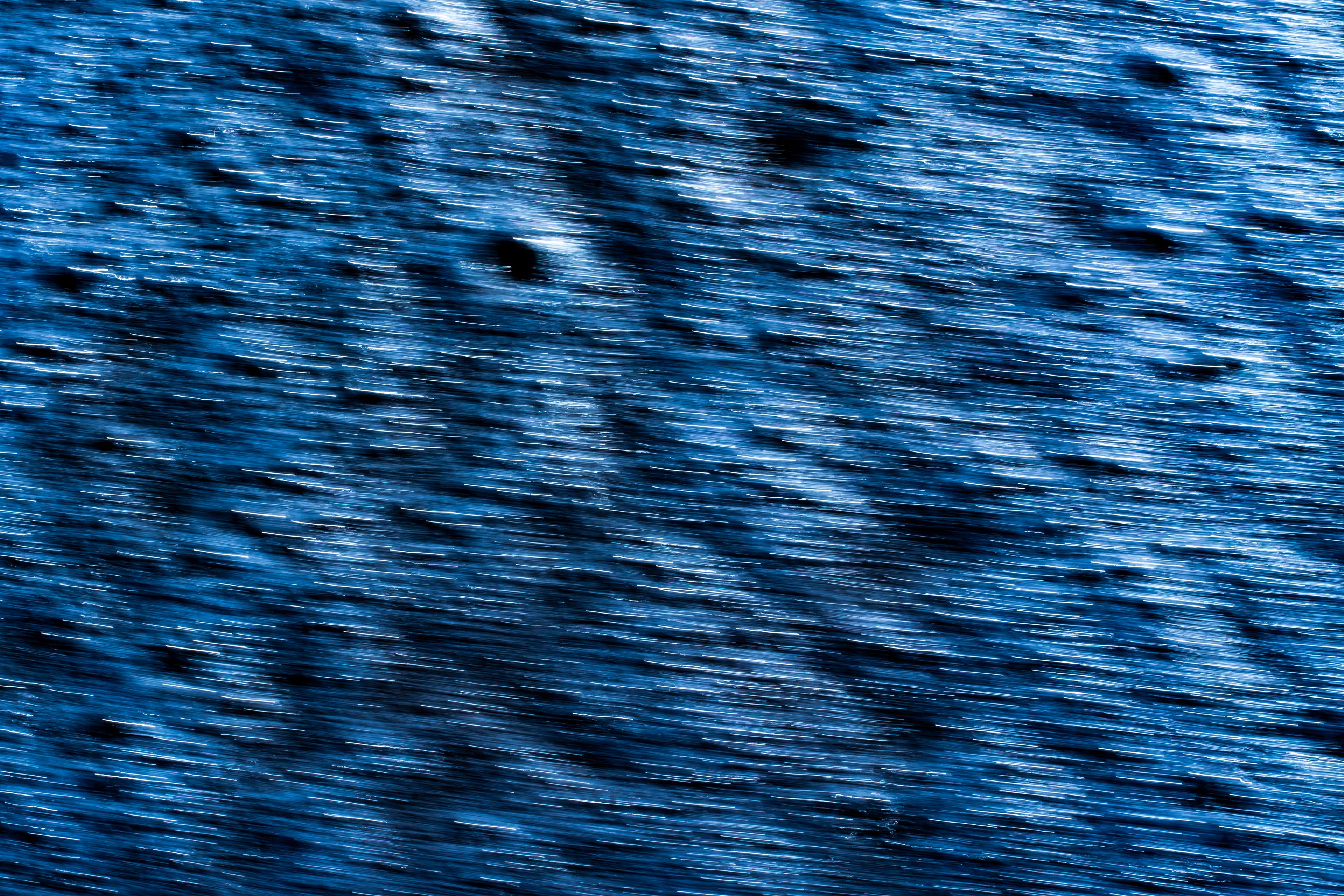 Cobalt blue water with a pebbled, textured surface — fine art ocean photography print, Whangamata NZ.