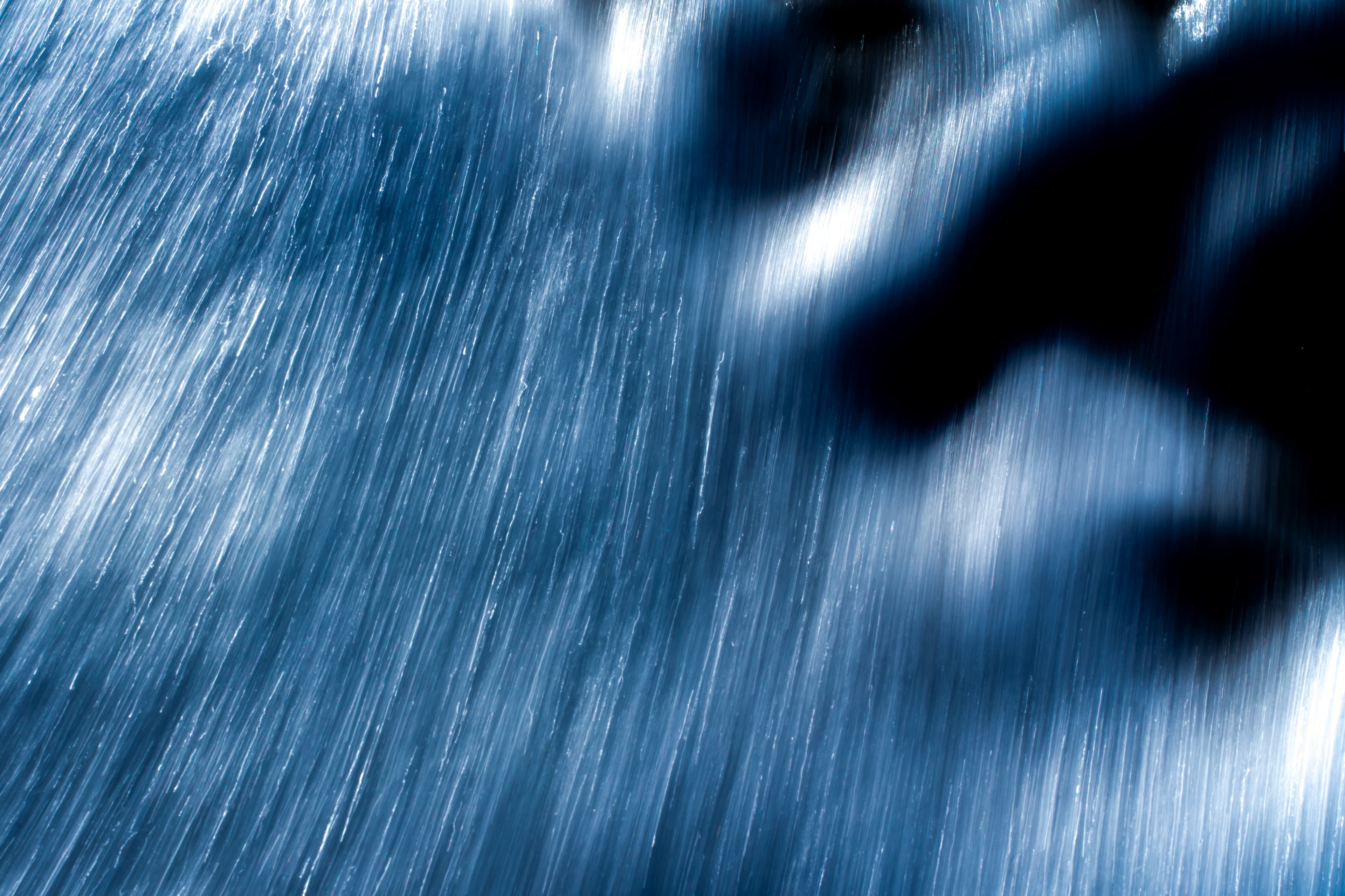 Monochrome motion-blur study of moving water — fine art ocean photography print, Whangamata NZ.