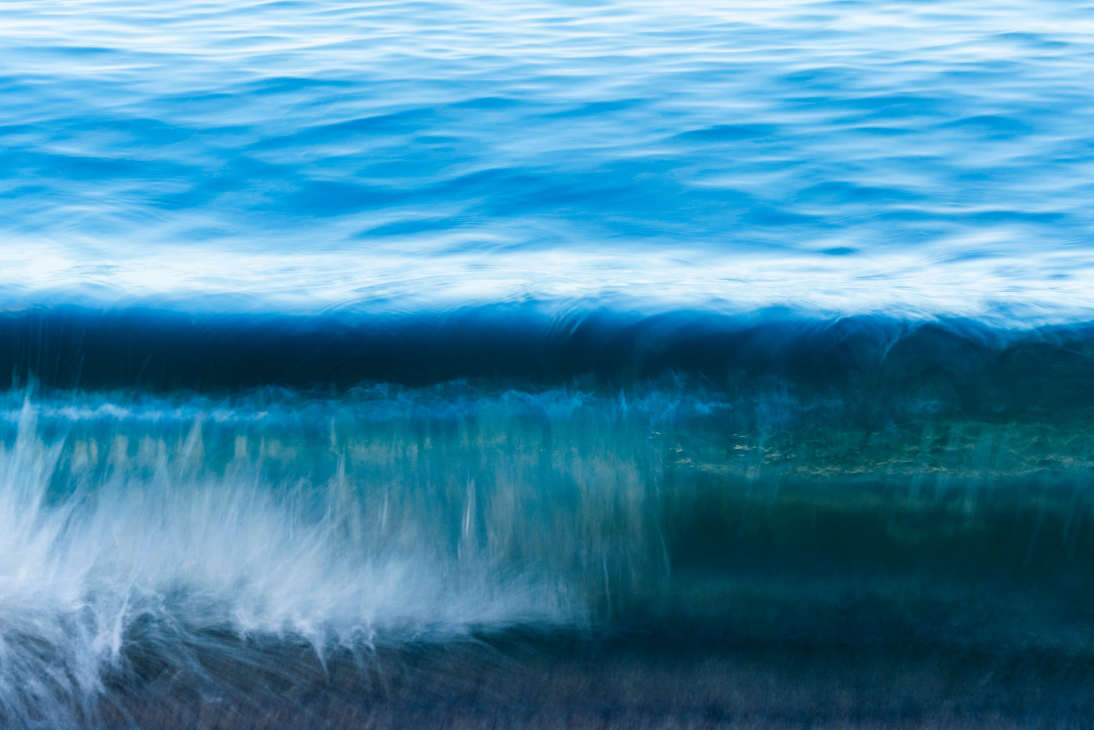 Clean azure wave breaking under bright daylight — fine art ocean photography print, Whangamata NZ.