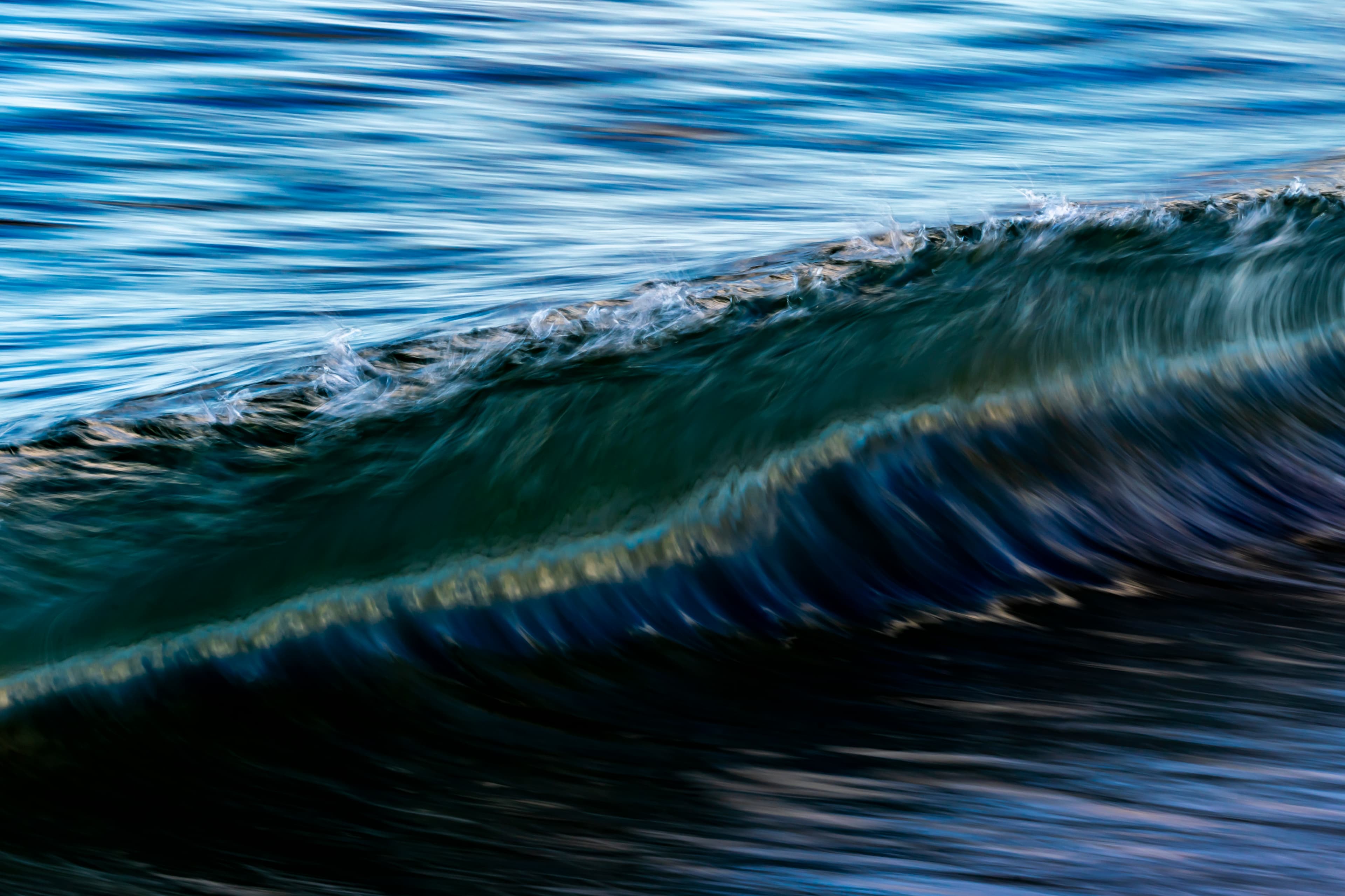 A deep teal wave curling into a dramatic barrel — fine art ocean photography print, Whangamata NZ.