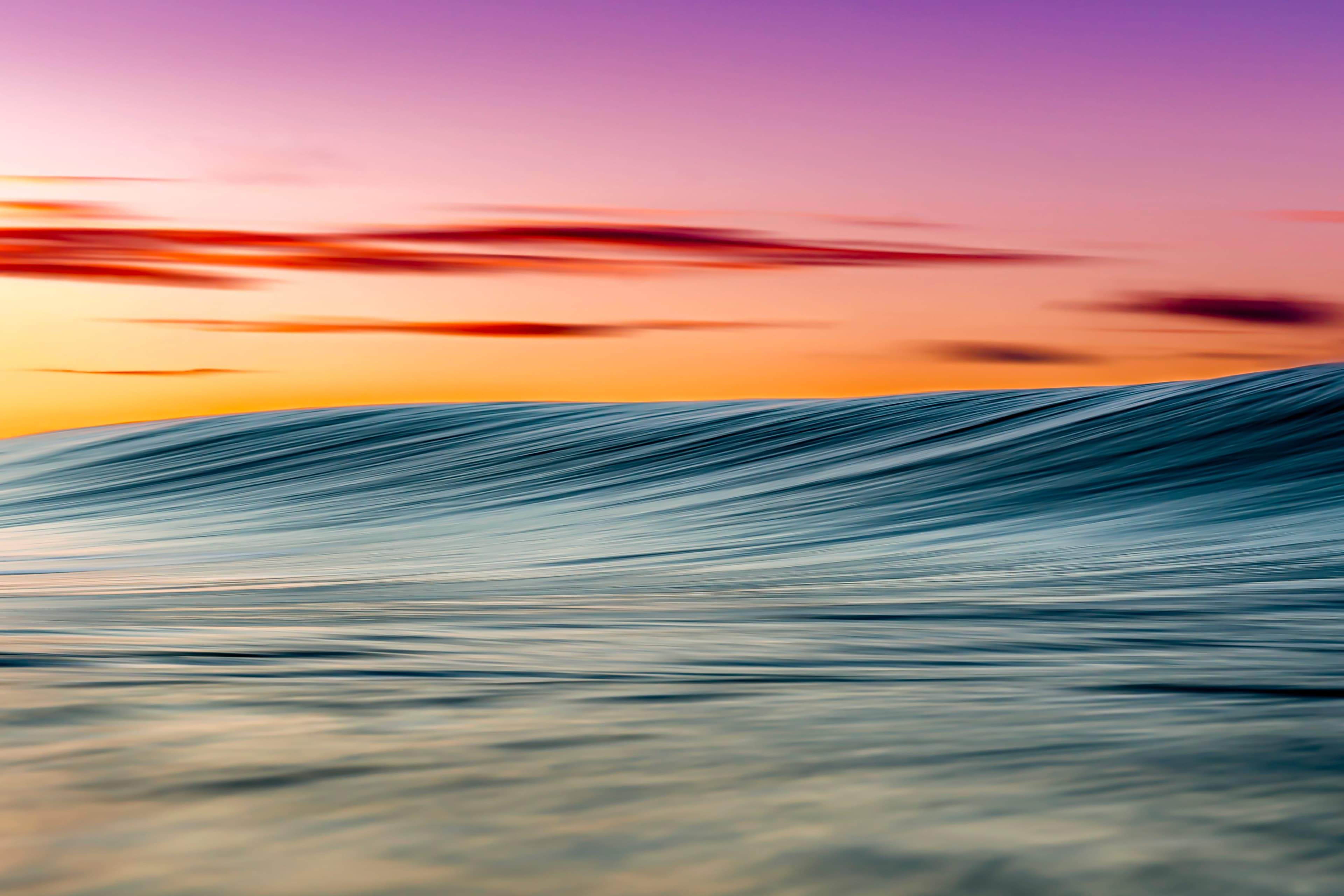 Sunset light forming abstract lines across the water — fine art ocean photography print, Whangamata NZ.